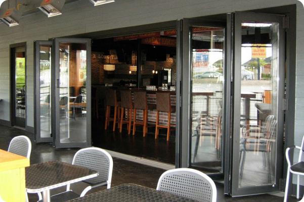 The best seat in the house at the bar and sensational sliding glass door entertainment flex space-Michigan Folding Doors