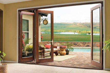 Slim sightlines and large openings are some of the advantages of accordion style glass door walls or bifold windows.