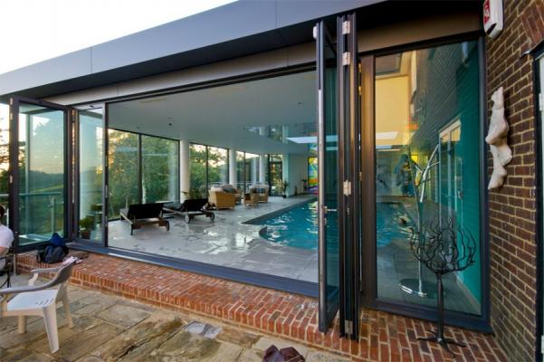 Michigan Folding Doors making a splash as pool enclosure, patio room, sun room, conservatory, shade space wall system