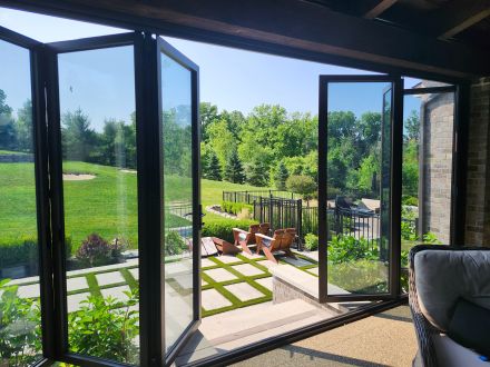 Reclaim space in more seasons and weather conditions with the addition of Michigan Folding Doors, glass wall improvement
