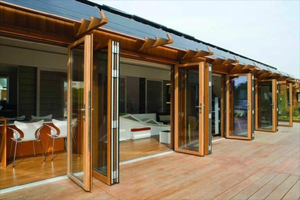 Wood interior, durable metal clad exterior folding glass doors make a vast difference in appearance and function in MI